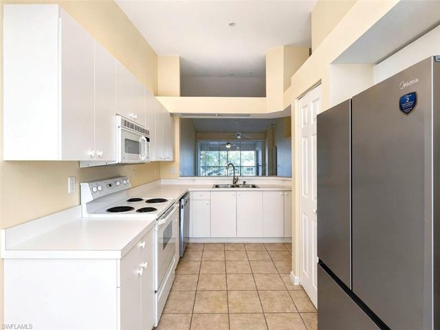 7553 Silver Trumpet LN 202, Naples, FL 34109