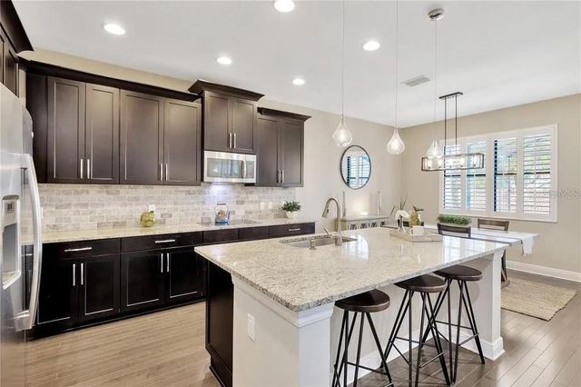 1607 FEATHER GRASS LOOP, Lutz, FL 33558