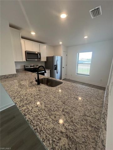 448 Burrstone DR, Lehigh Acres, FL 33974