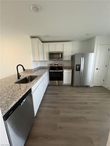 448 Burrstone DR, Lehigh Acres, FL 33974