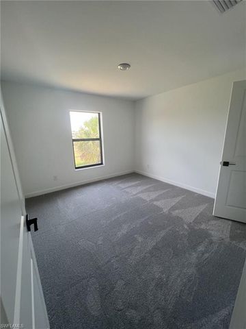 448 Burrstone DR, Lehigh Acres, FL 33974