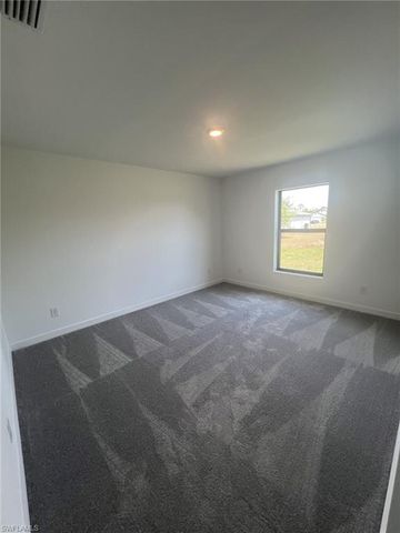 448 Burrstone DR, Lehigh Acres, FL 33974