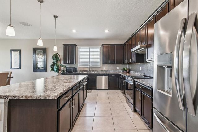 2305 GLADIOLUS LANE, Mascotte, FL 34753