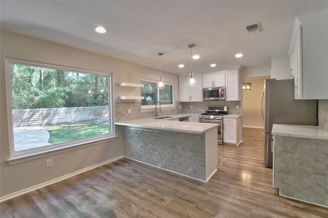 18 Shinyrock Place, Spring, TX 77381