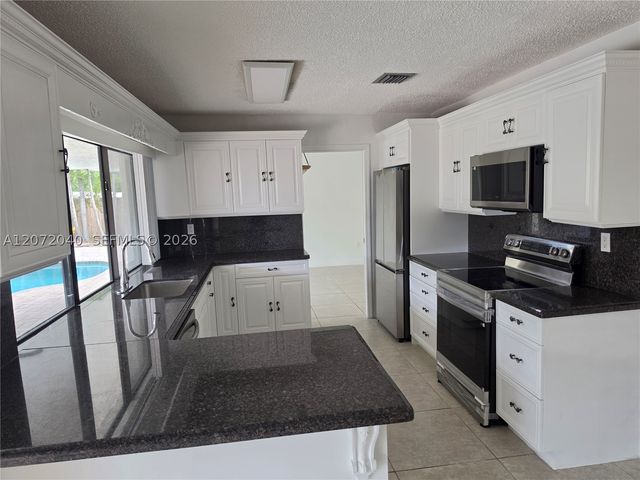 11956 SW 97th St ., Miami, FL 33186