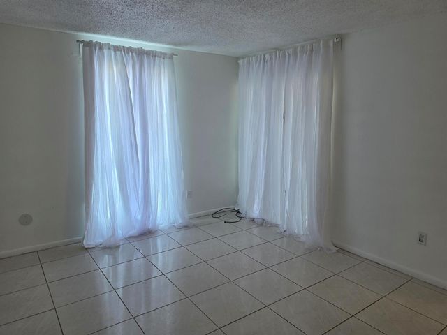 661 N UNIVERSITY Drive 1-104, Pembroke Pines, FL 33024