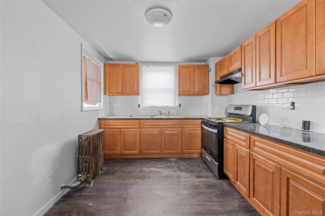 126-19 Sutter Avenue, South Ozone Park, NY 11420