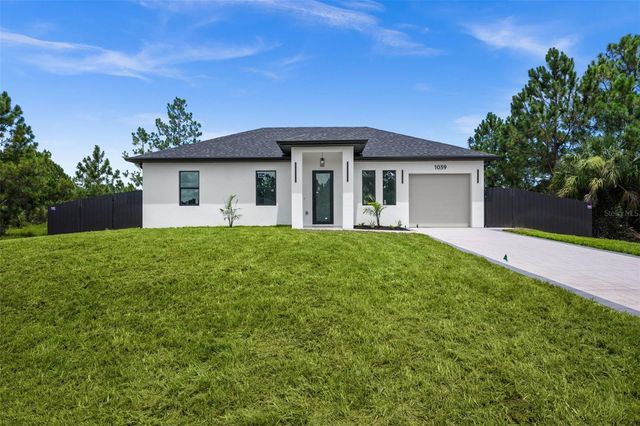 1039 BASSINGER AVENUE S, Lehigh Acres, FL 33974