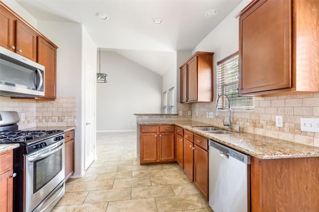 10414 Whisper Bluff Drive, Humble, TX 77396