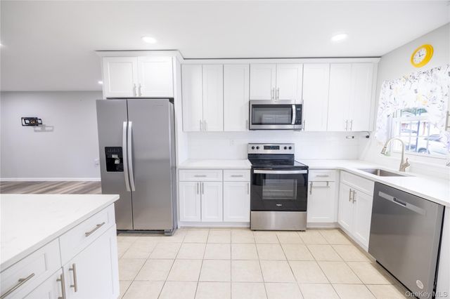 250A Newcastle Court, Ridge, NY 11961