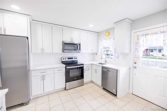 250A Newcastle Court, Ridge, NY 11961