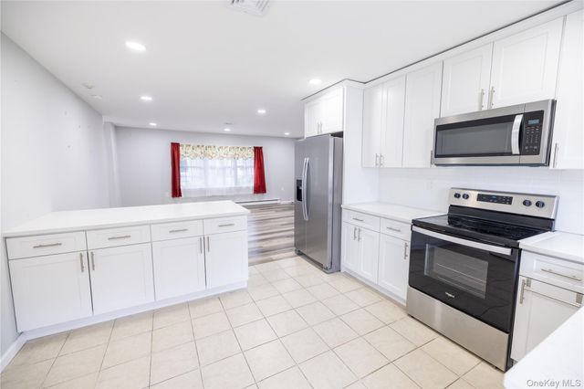 250A Newcastle Court, Ridge, NY 11961