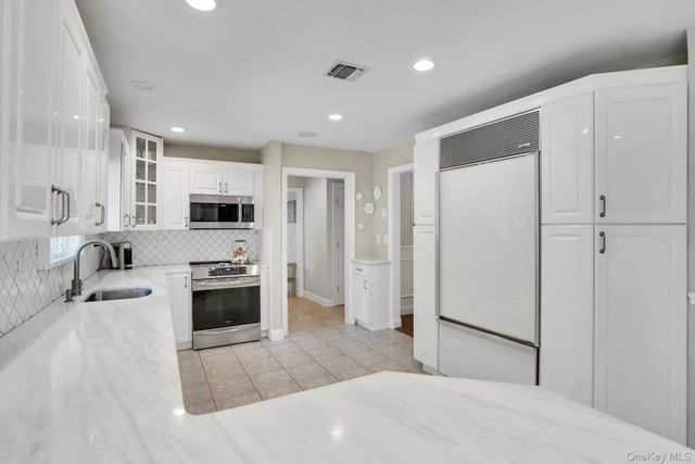 65 Shoreham Drive E, Dix Hills, NY 11746
