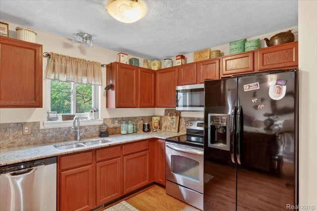 764 Town Trail, Pinckney Village, MI 48169