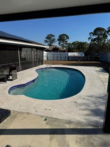 702 NW Orchid St, Port St. Lucie, FL 34983