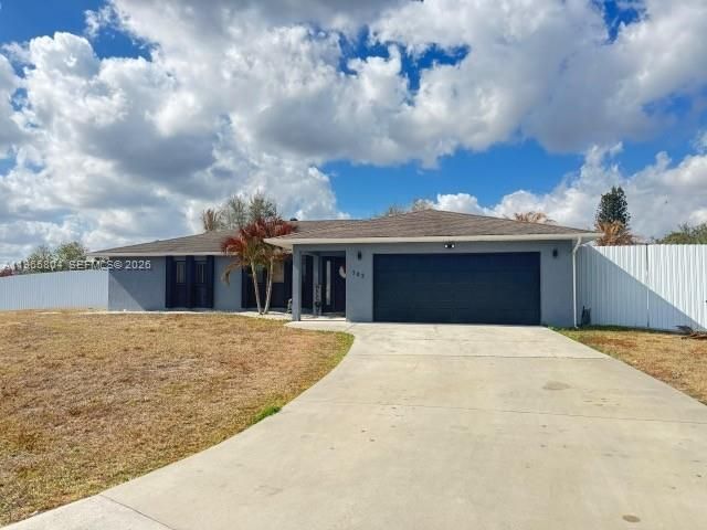 702 NW Orchid St, Port St. Lucie, FL 34983