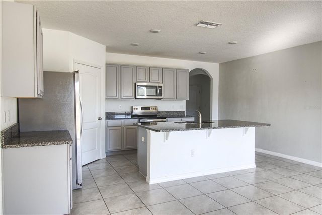 521 NICKEN GROVE, Davenport, FL 33837