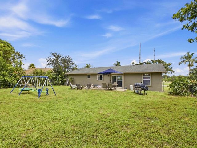 234 La Mancha Avenue, Royal Palm Beach, FL 33411