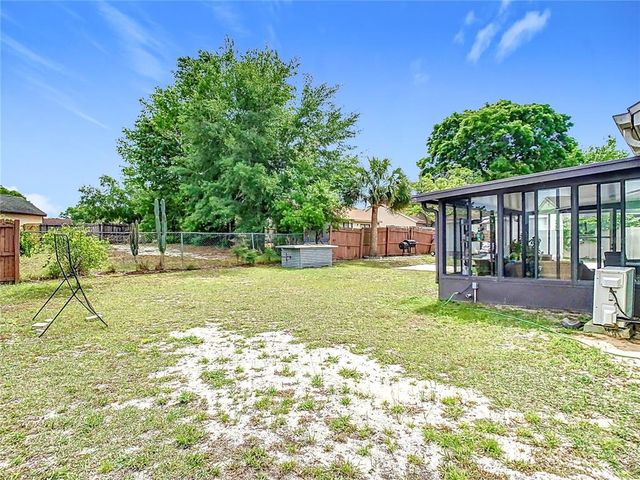 7974 VILLAGE GREEN ROAD, Orlando, FL 32818