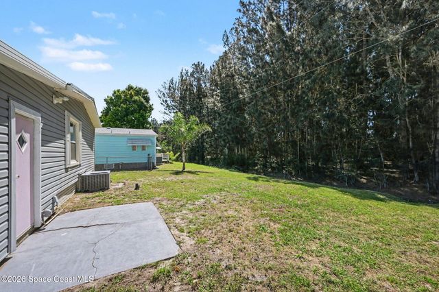 421 Papaya Circle, Barefoot Bay, FL 32976