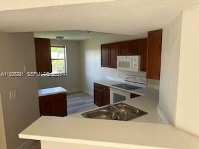 8741 Wiles Rd 208, Coral Springs, FL 33067