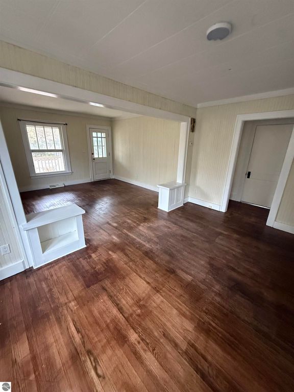 Spacious interior of 610 S Washington Street, featuring hardwood floors, natural light, and a welcoming layout, ideal for comfortable living in Mt Pleasant, MI.