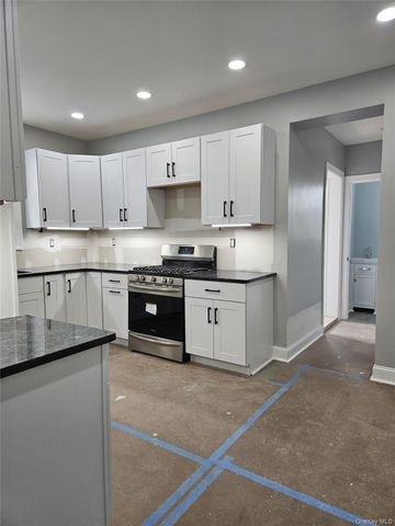 30-32 84th Street, East Elmhurst, NY 11370