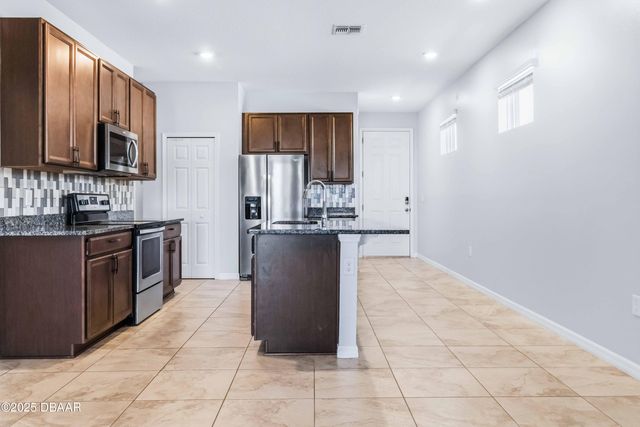 719 Ladyfish Lane, New Smyrna Beach, FL 32168