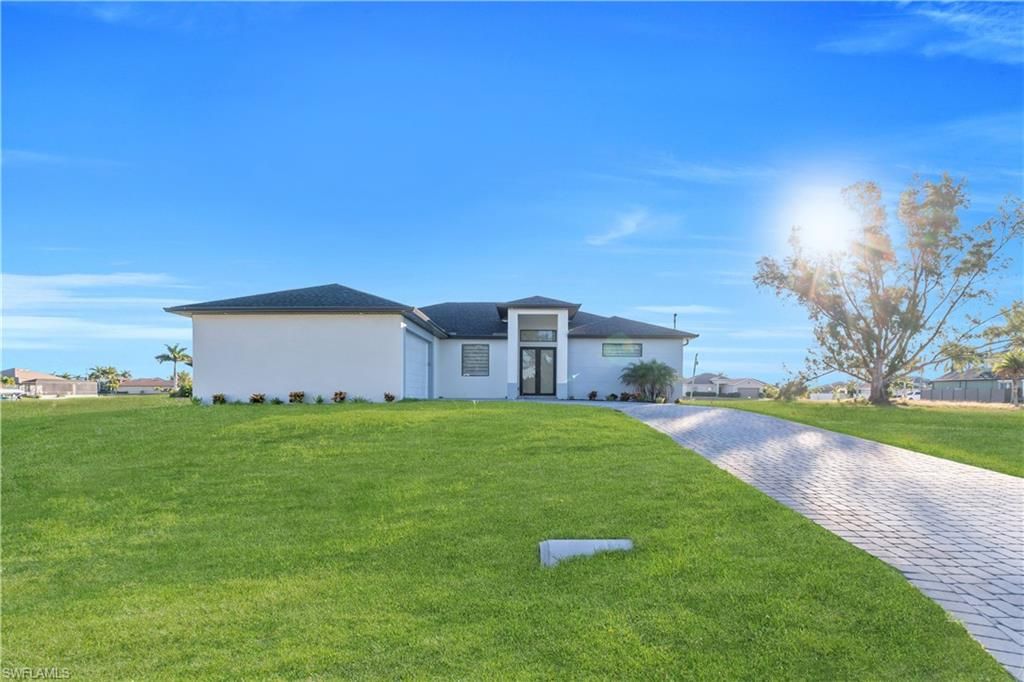 911 NW 37th PL, CAPE CORAL, FL 33993 — exterior