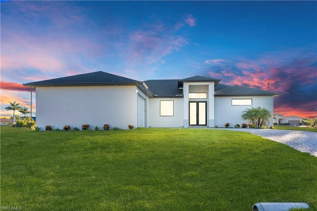 911 NW 37th PL, CAPE CORAL, FL 33993 — photo 2