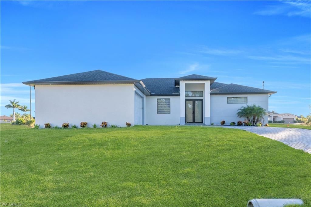 911 NW 37th PL, CAPE CORAL, FL 33993 — photo 3
