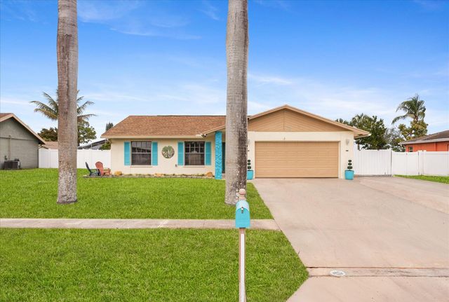 111 Madrid Street, Royal Palm Beach, FL 33411