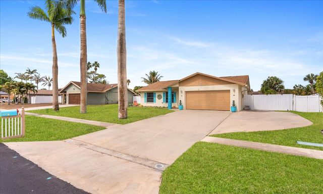 111 Madrid Street, Royal Palm Beach, FL 33411