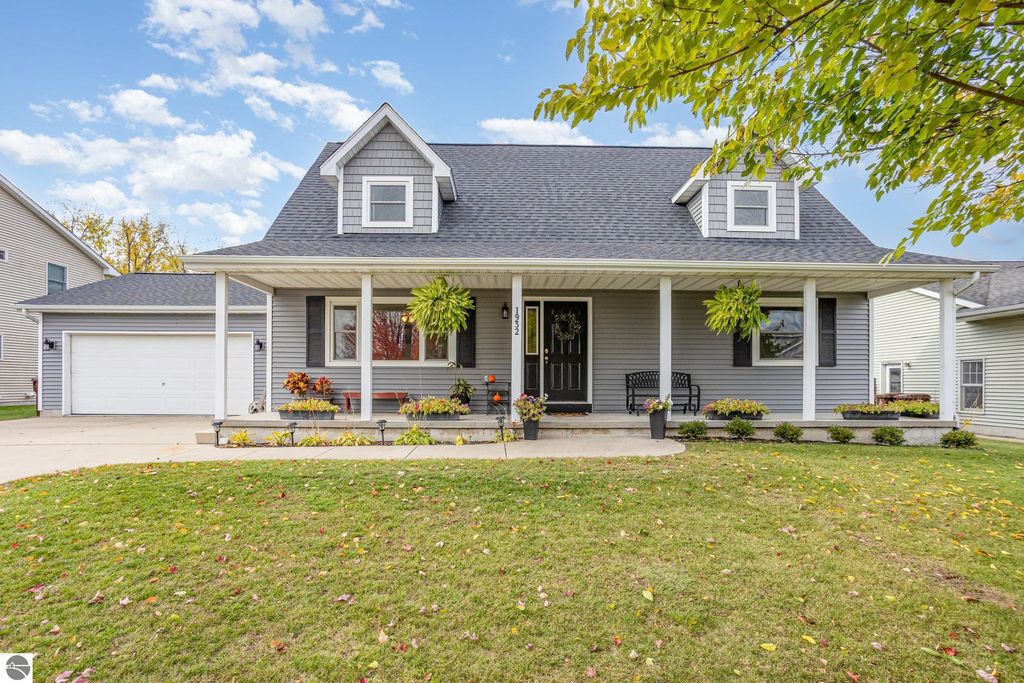 Charming 3-bedroom home at 1932 Churchill Boulevard, Mt Pleasant, MI, featuring a modern exterior with new roof and siding, inviting porch, and landscaped front yard.