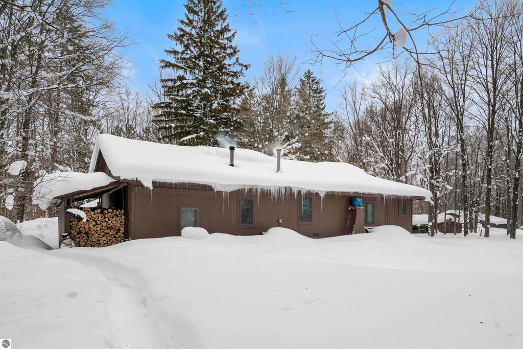 Image 2 of property listing at 8460 NE Covert Road, Mancelona, MI 49659