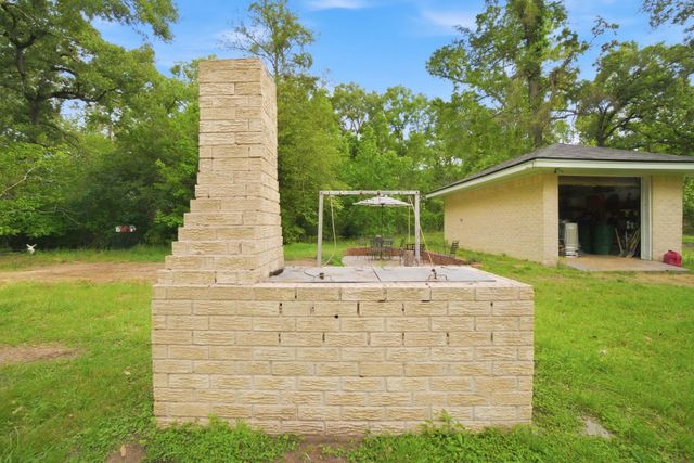 6161 Woodland Lakes Loop, Willis, TX 77378