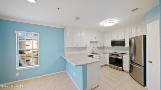 1701 THE GREENS Way 424, Jacksonville Beach, FL 32250