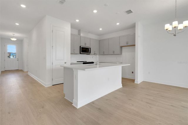 1018 SWAMP CHESTNUT LOOP, Lady Lake, FL 32159