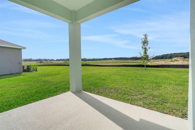 1018 SWAMP CHESTNUT LOOP, Lady Lake, FL 32159