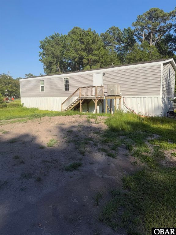 Image 1 of property listing at 833 Lindbergh Berry Road, Manteo, NC 27954