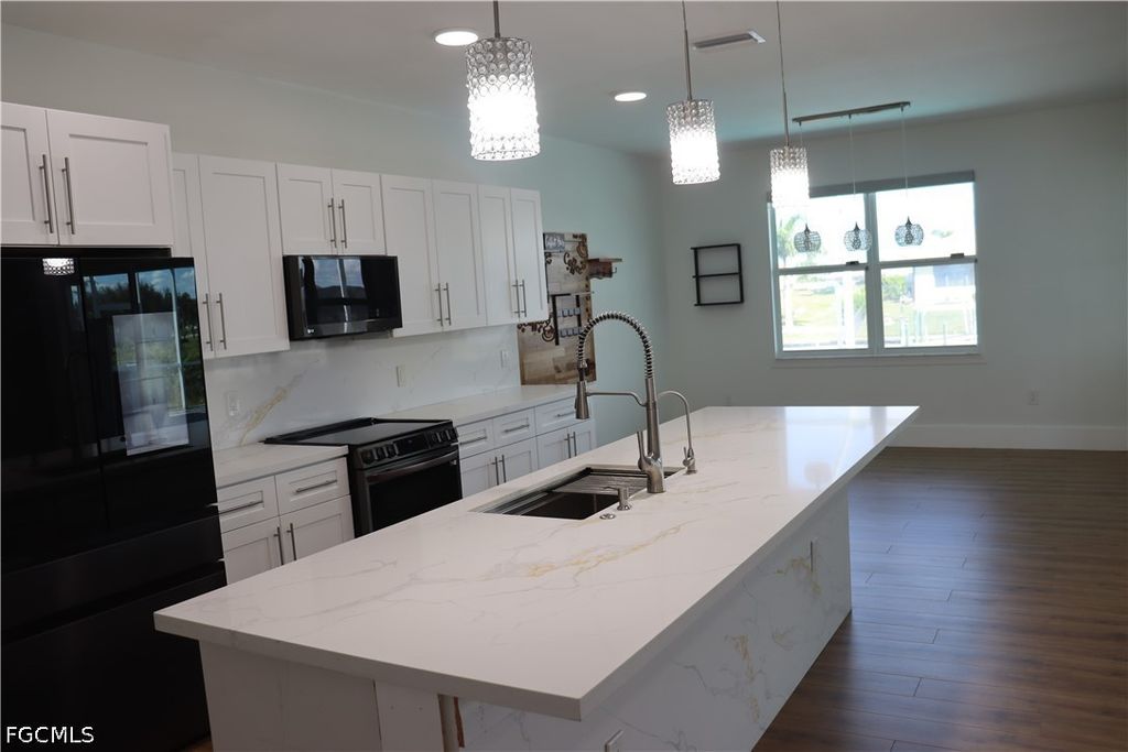 Image 10 of property listing at 1857 NW 36th PL, Cape Coral, FL 33993