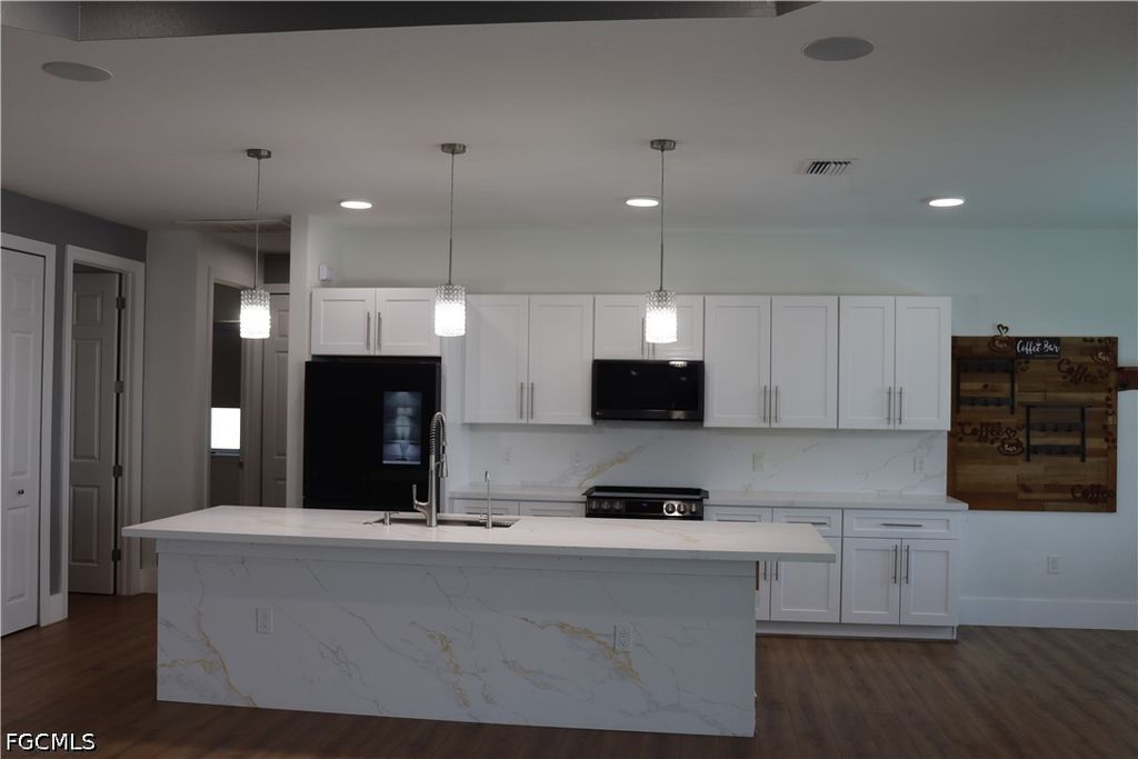 Image 7 of property listing at 1857 NW 36th PL, Cape Coral, FL 33993