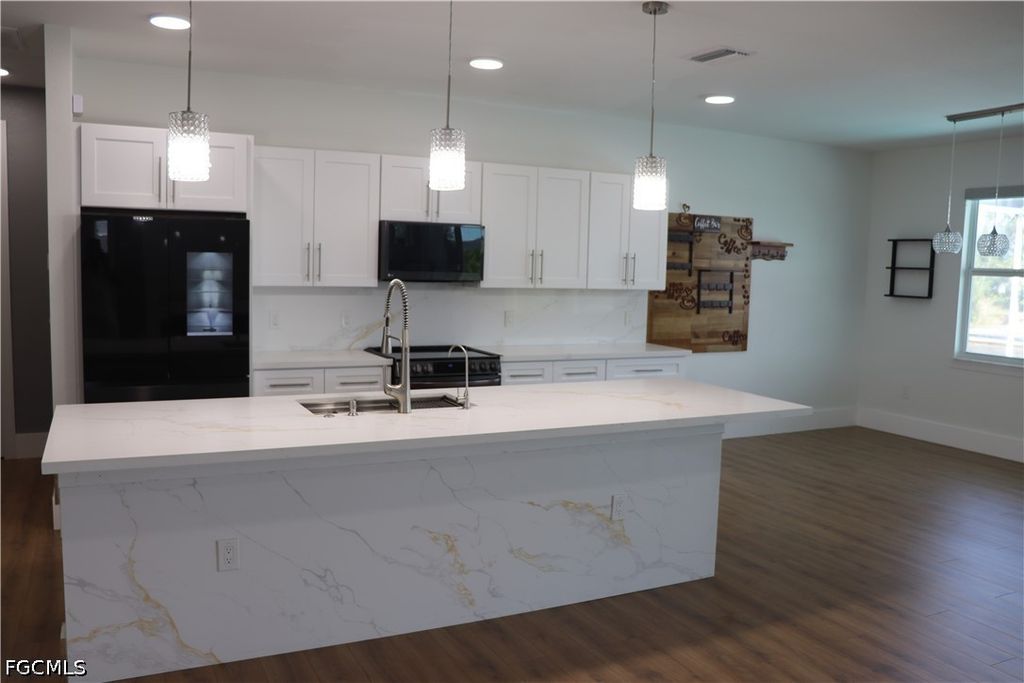 Image 8 of property listing at 1857 NW 36th PL, Cape Coral, FL 33993