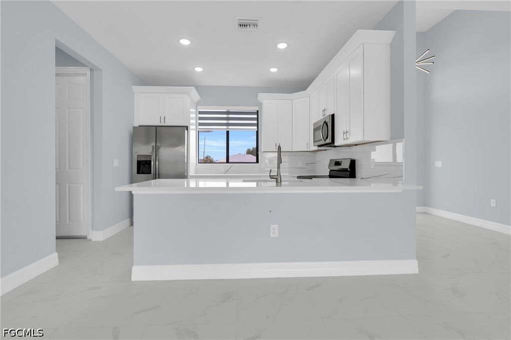 Image 8 of property listing at 627 NW 2nd TER, Cape Coral, FL 33993