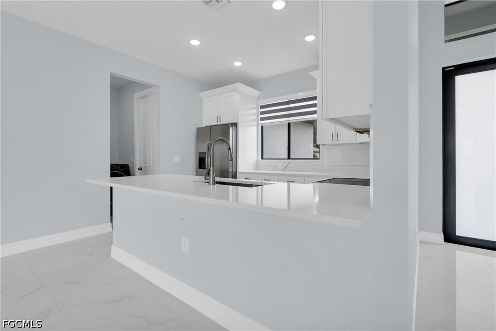 Image 9 of property listing at 627 NW 2nd TER, Cape Coral, FL 33993
