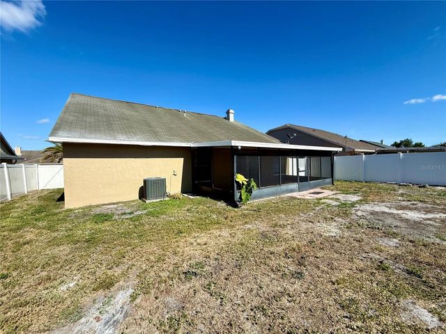 7048 HOLLOWELL DRIVE, Tampa, FL 33634