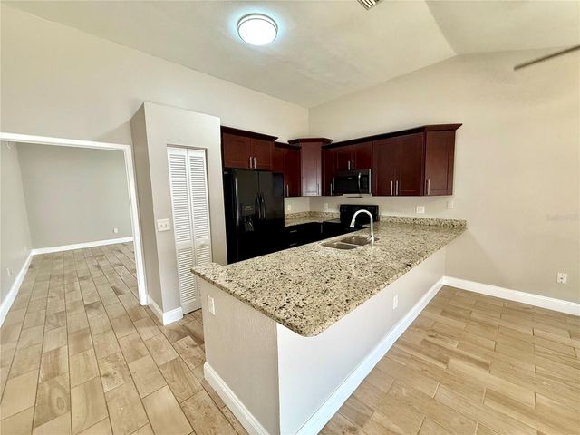 7048 HOLLOWELL DRIVE, Tampa, FL 33634