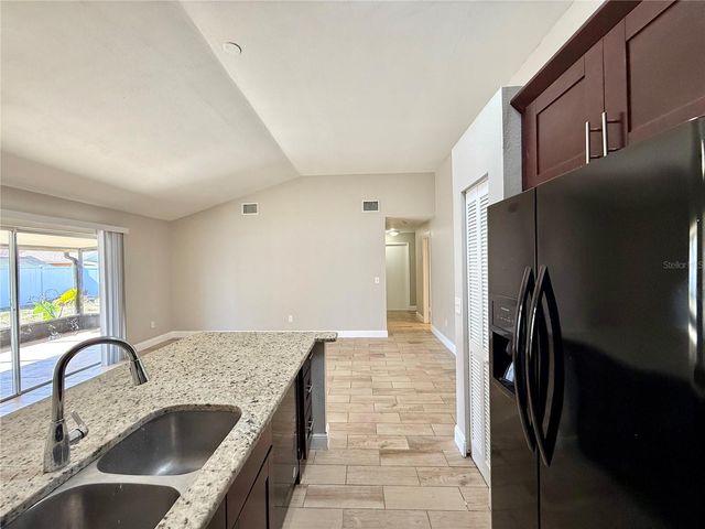 7048 HOLLOWELL DRIVE, Tampa, FL 33634