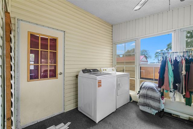 9098 LAKE HATCHINEHA ROAD, Haines City, FL 33844