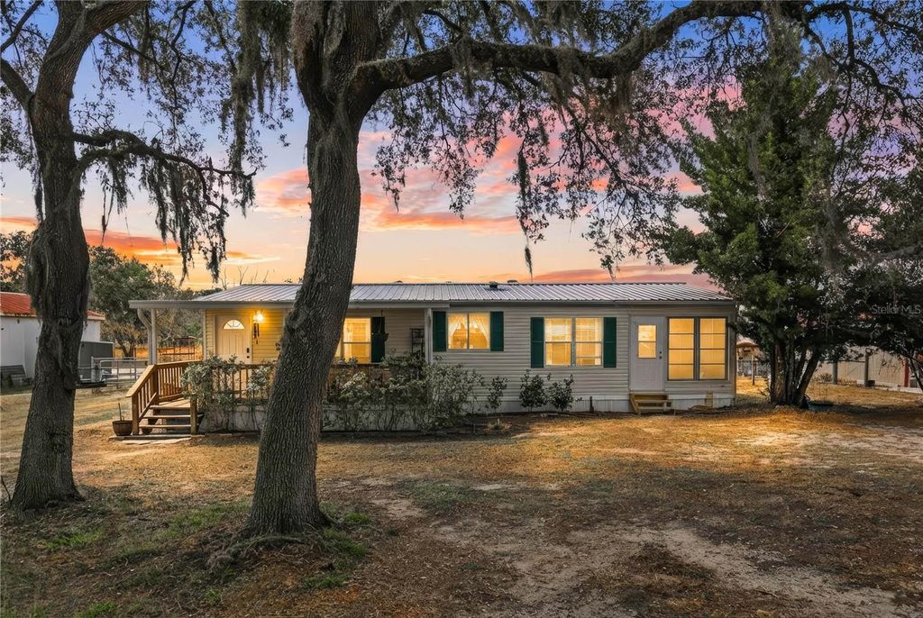 Image 1 of property listing at 9098 LAKE HATCHINEHA ROAD, Haines City, FL 33844